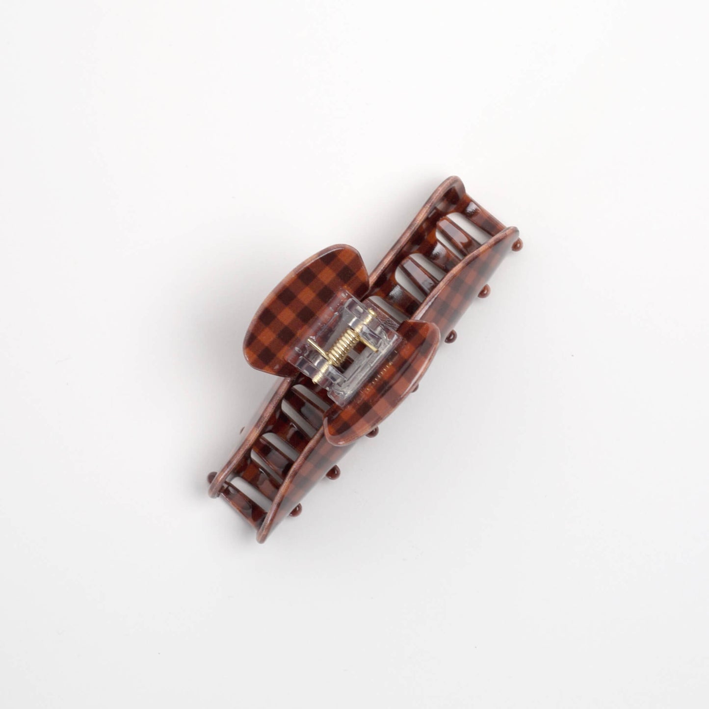 THOC Sorelle Claw Clip in brown and terracotta orange gingham shown from the top angle 