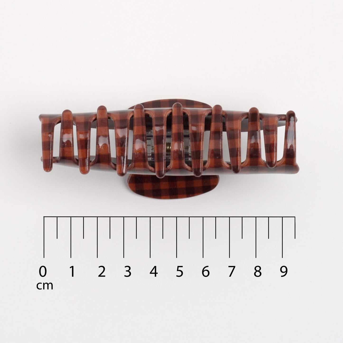THOC Sorelle Claw Clip with a ruler for scale on a white background