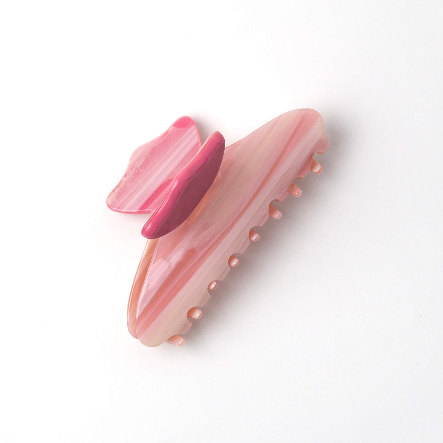 THOC Gigi Claw Clip in Candy Pink Cloud colour on its side on a white background