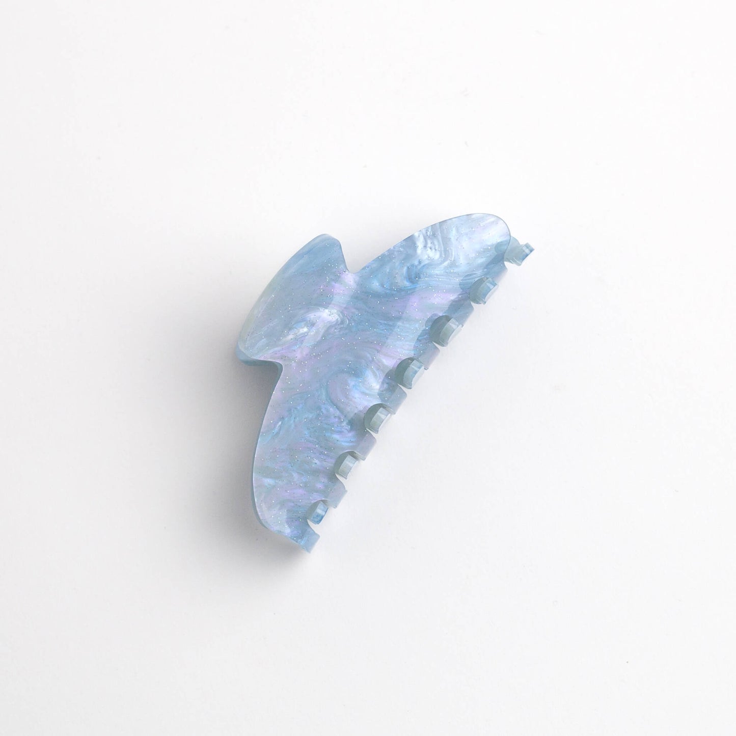THOC Sofie Claw Clip in Blue Ice colour on its side on a white background