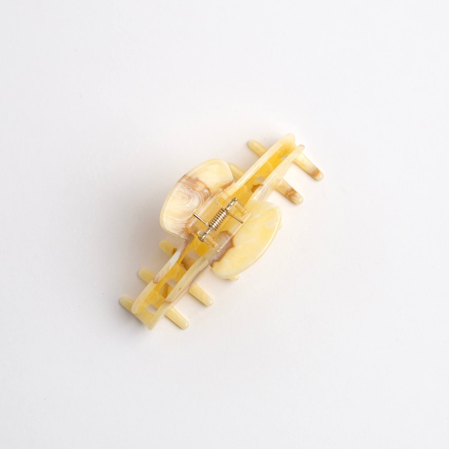 THOC Sloane Claw Clip in Buttercream colour with claws facing down, on a white background