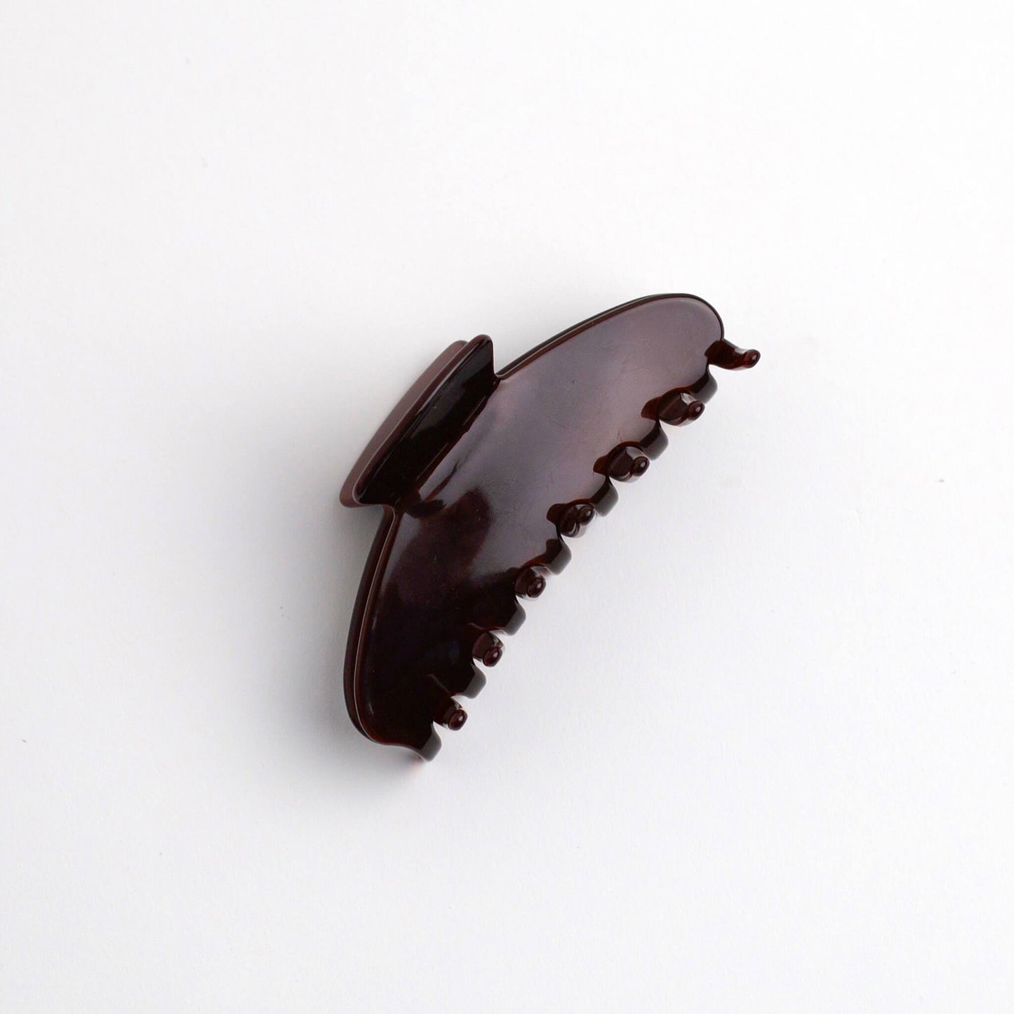 THOC Sloane Claw Clip in Toffee Pop colour on its side on a white background