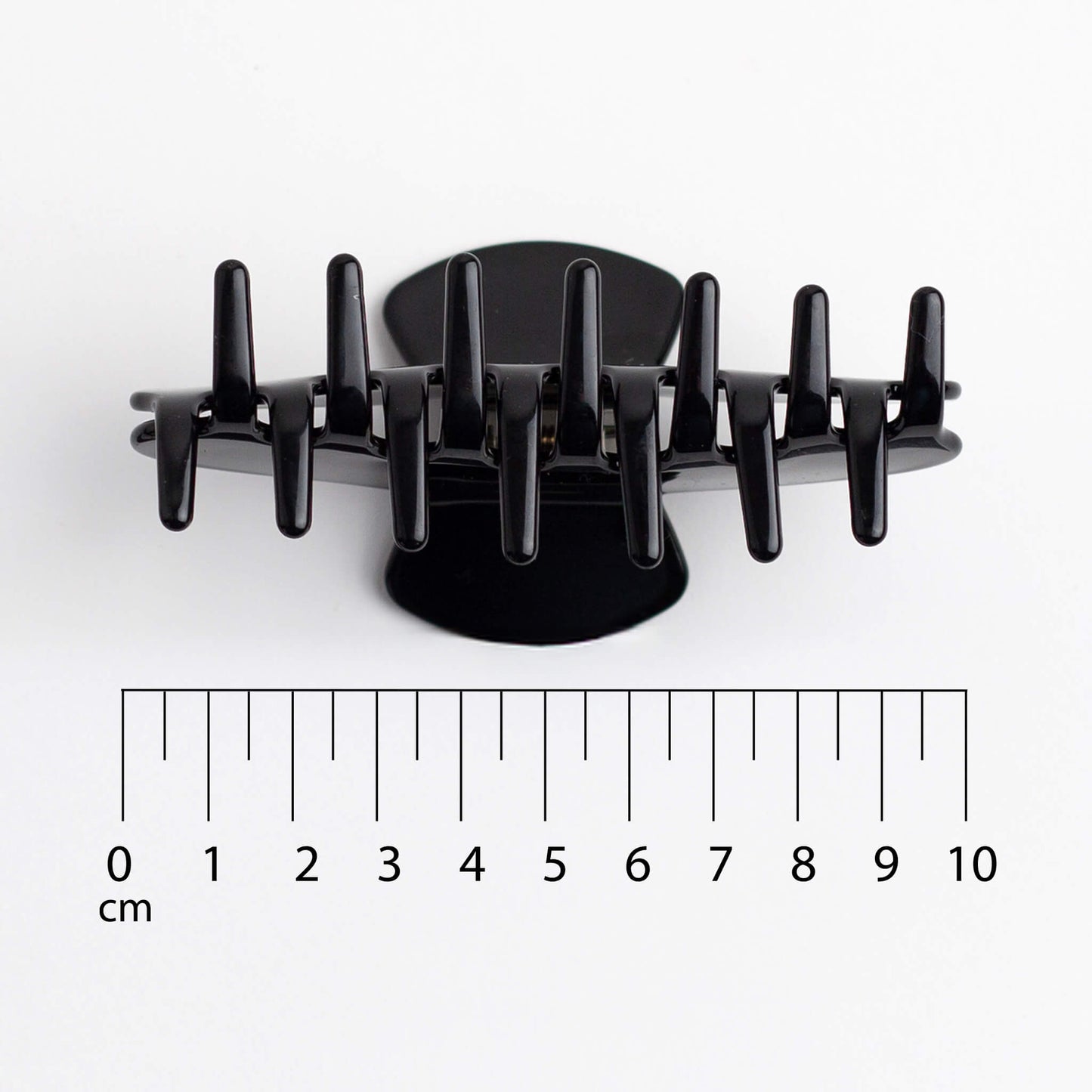 THOC Sloane Claw Clip in Espresso colour claws facing up on a white background with a ruler showing 10cm wide