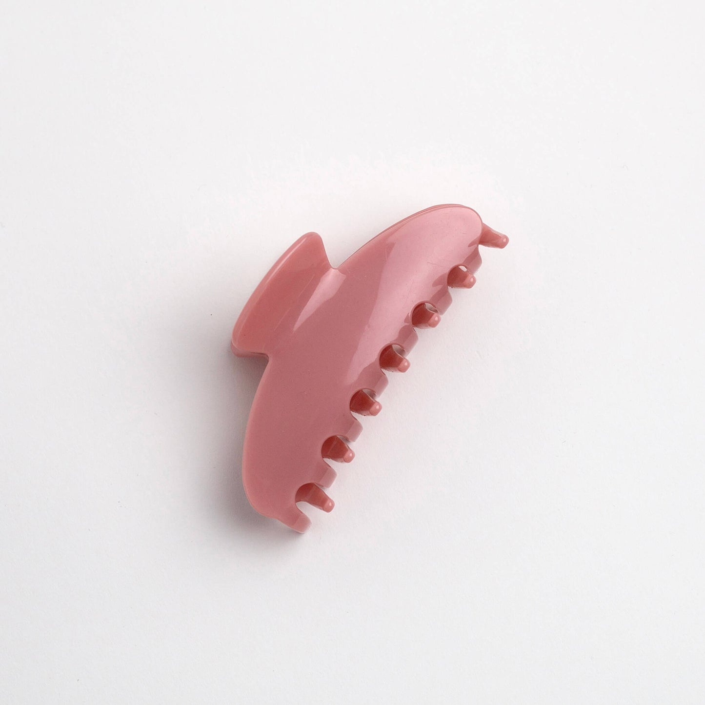 THOC Sloane Claw Clip in Candy Pink colour on its side on a white background