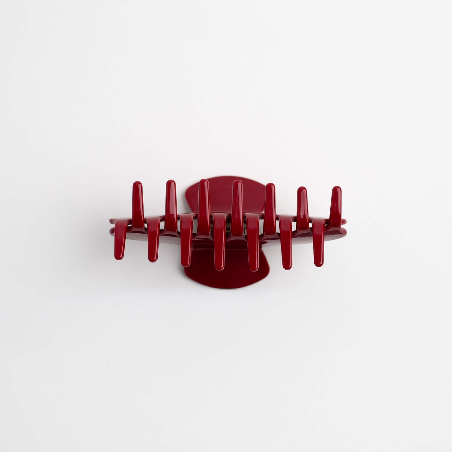 THOC Sloane Claw Clip in Cherry Glaze colour claws facing up on a white background