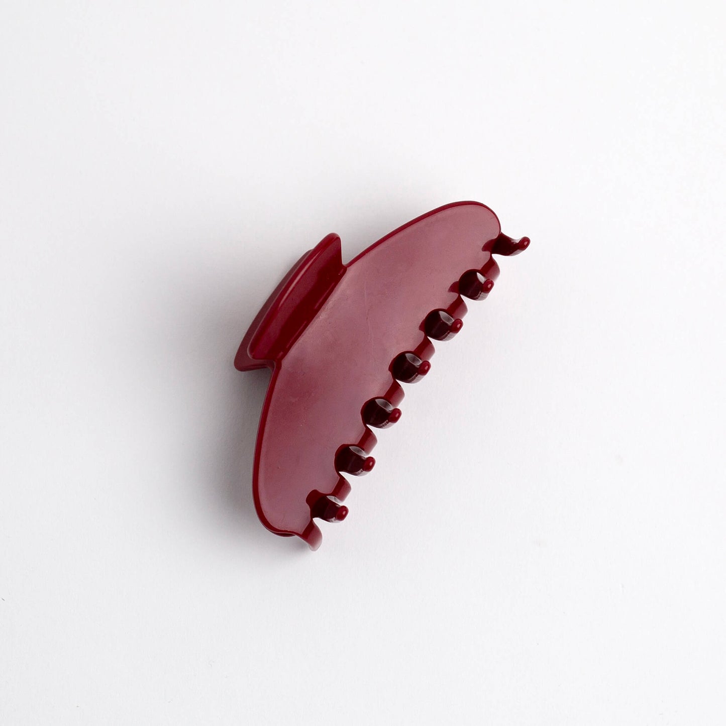 THOC Sloane Claw Clip in Cherry Glaze colour on its side on a white background