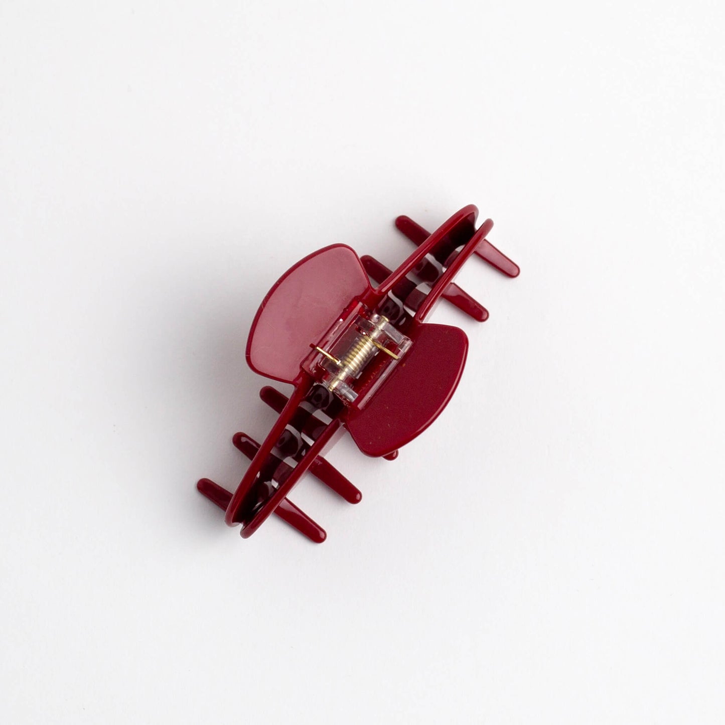 THOC Sloane Claw Clip in Cherry Glaze colour with claws facing down, on a white background
