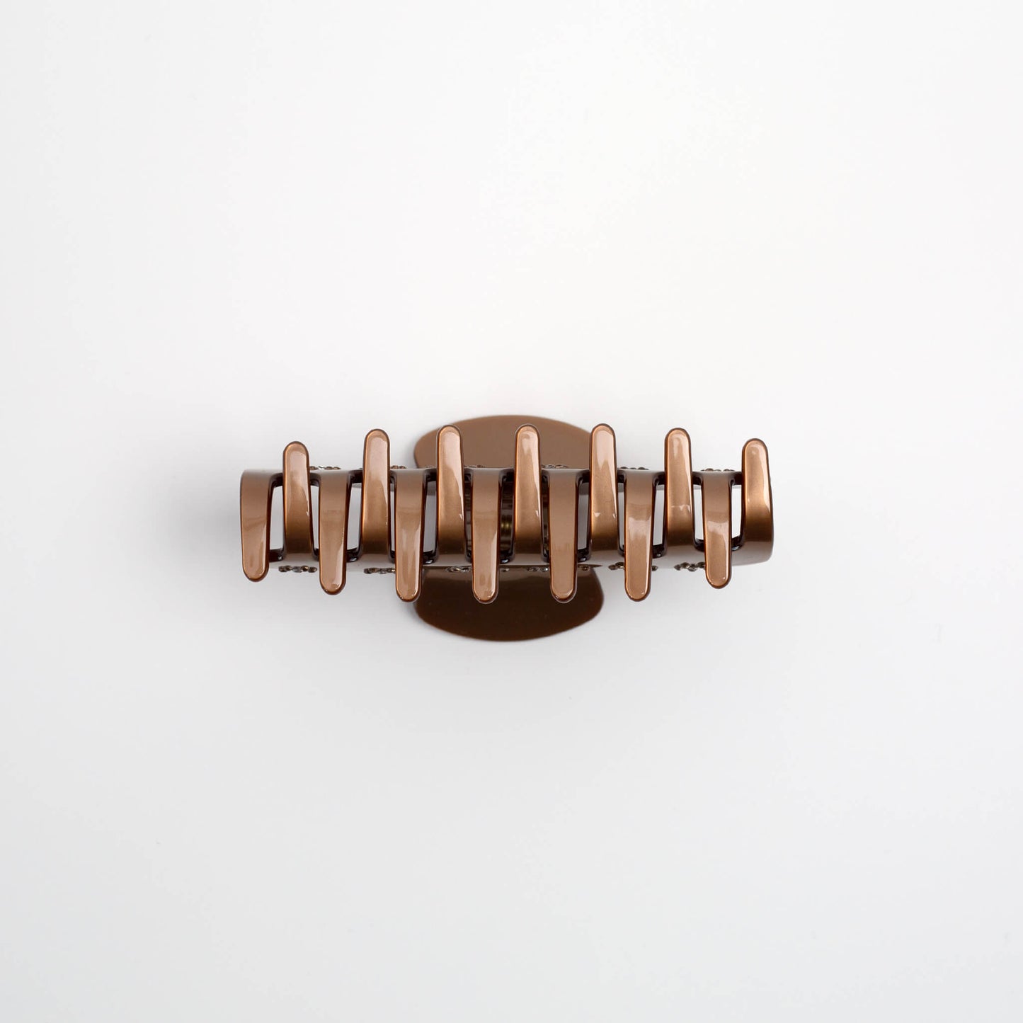 THOC Nori Claw Clip in golden brown with sparkly bejewelled flower pattern on side from the bottom 