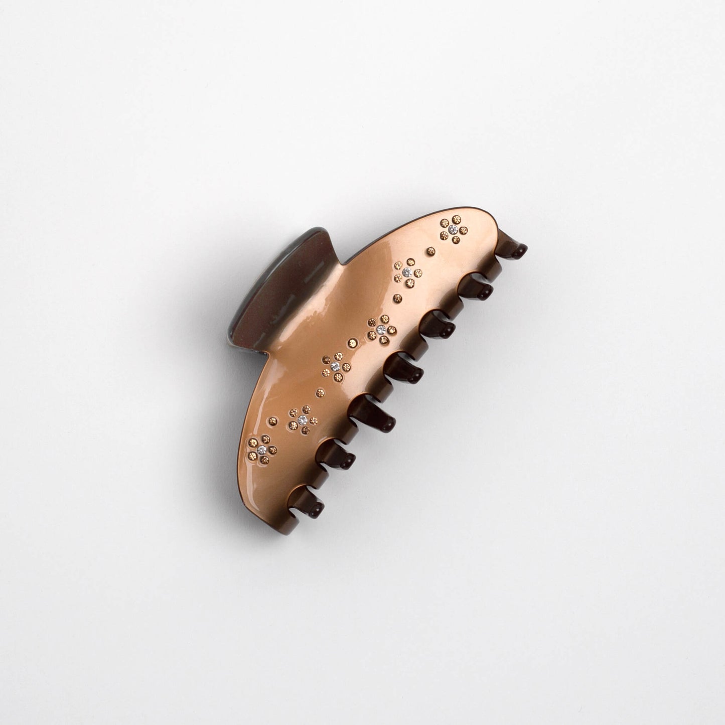 THOC Nori Claw Clip in golden brown with sparkly bejewelled flower pattern on side from the side