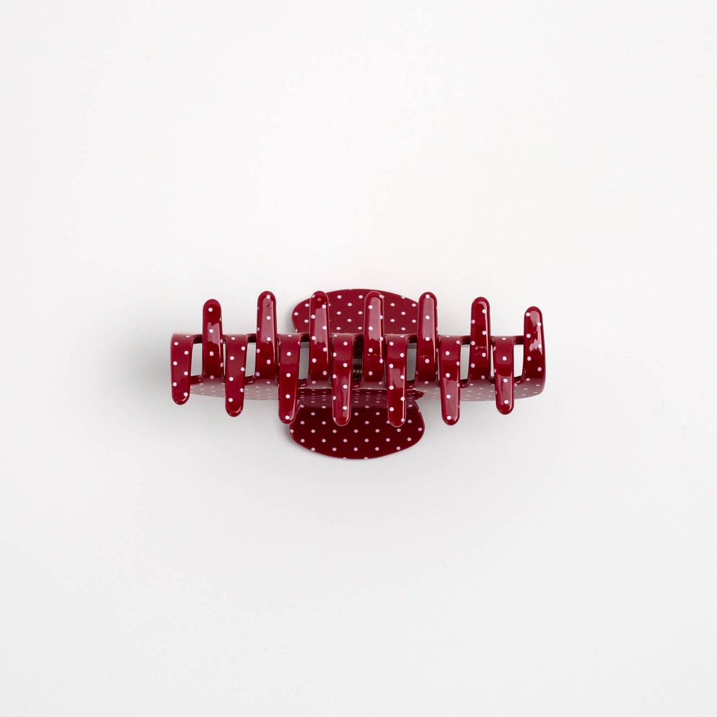 THOC Gina Claw Clip in Red with white polka dot shown from the bottom angle