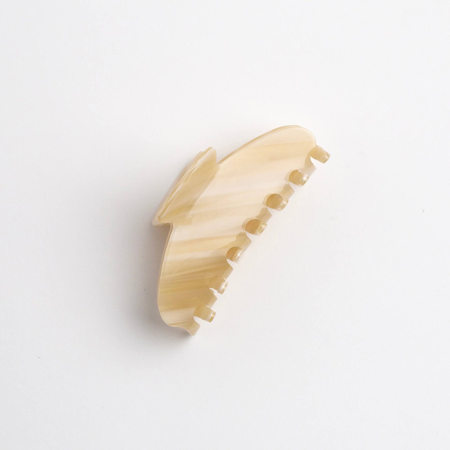 THOC Lemi Claw Clip in Lemon Luxe colour on its side on a white background