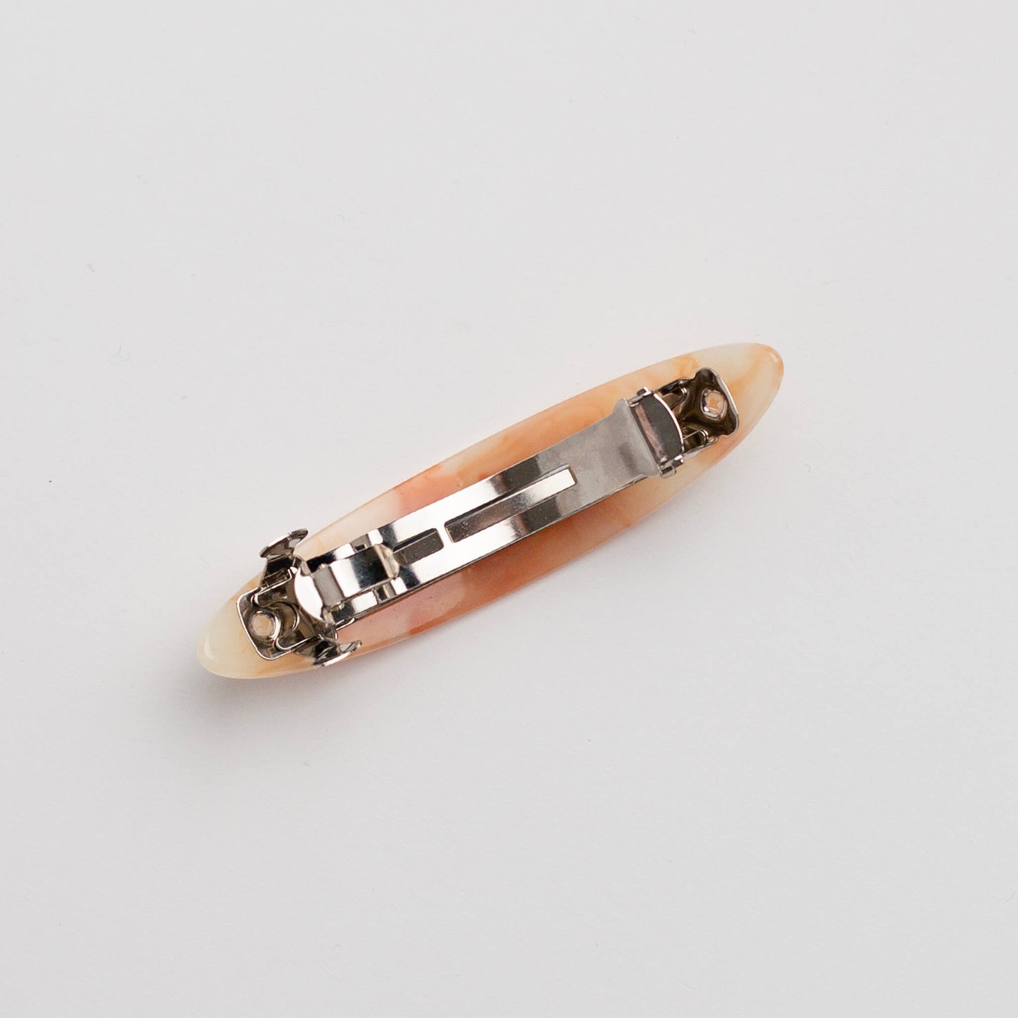 THOC Juno Barrette Hair Clip Slim Orange Sorbet clip side up on a white background