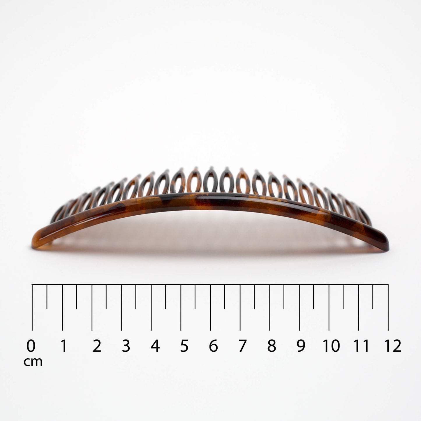 THOC Eloise French Comb with a ruler for scale on a white background