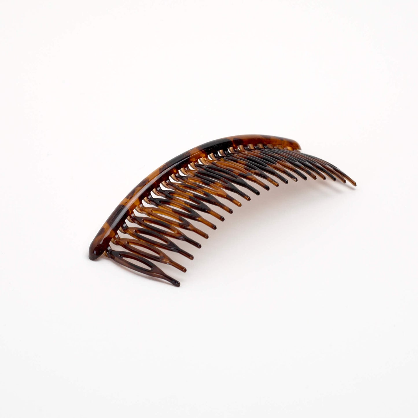 THOC Eloise French comb, wide, shown at an angle in brown tortoiseshell