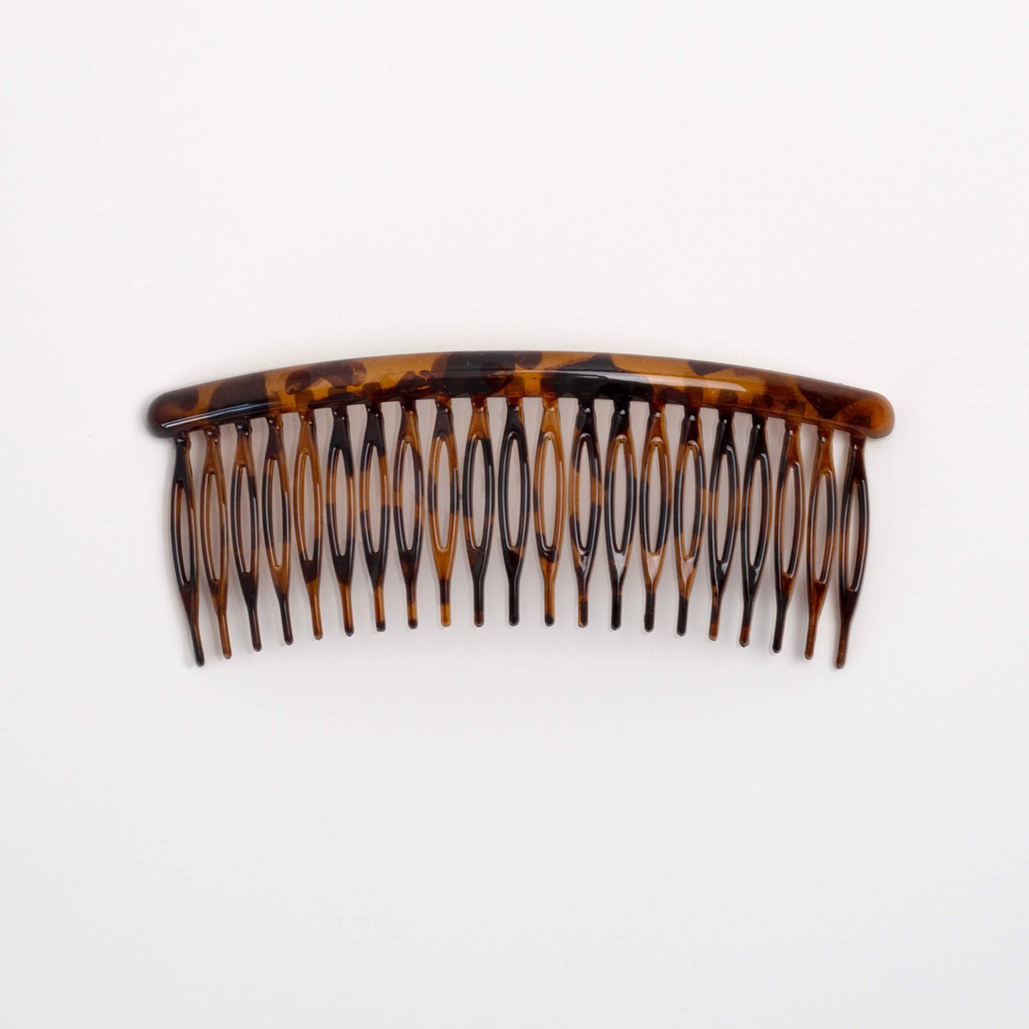 THOC Eloise French comb shown from the top, in brown sugar colour tortoiseshell