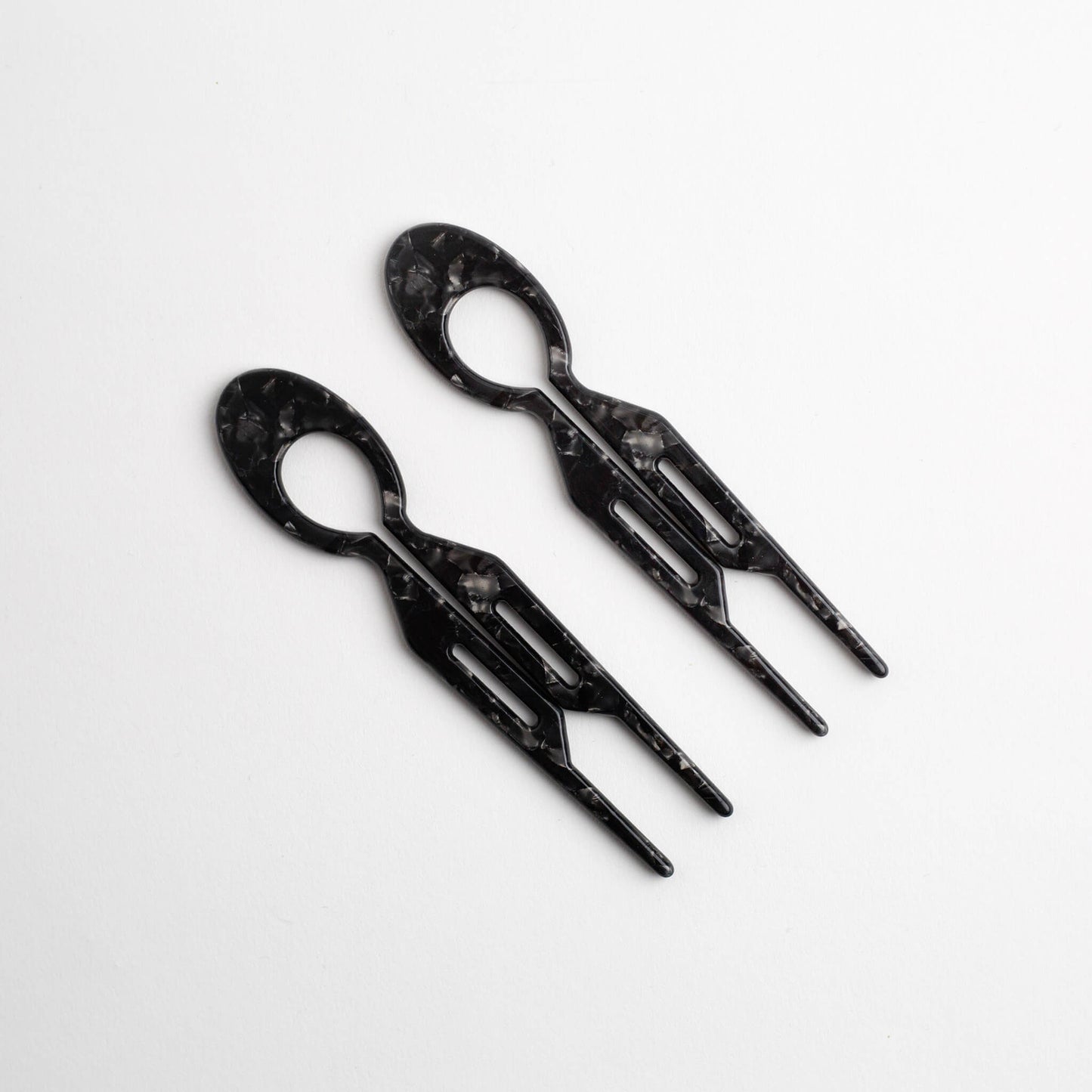 Two THOC Camille Hair Pin Black Coffee marble-patterned on a white background