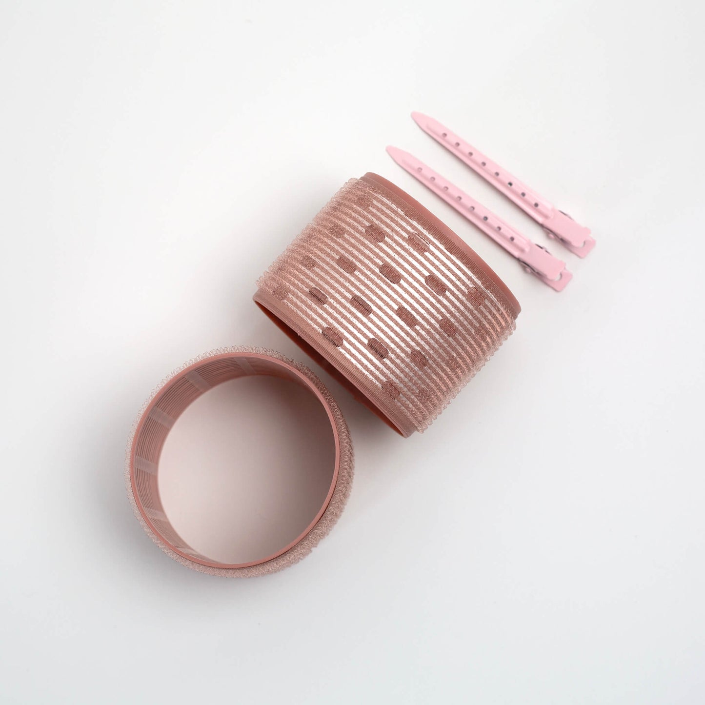 THOC Ceramic Thermal Hair Rollers Two large sized one shown upright and one shown lying down on side with hair pins