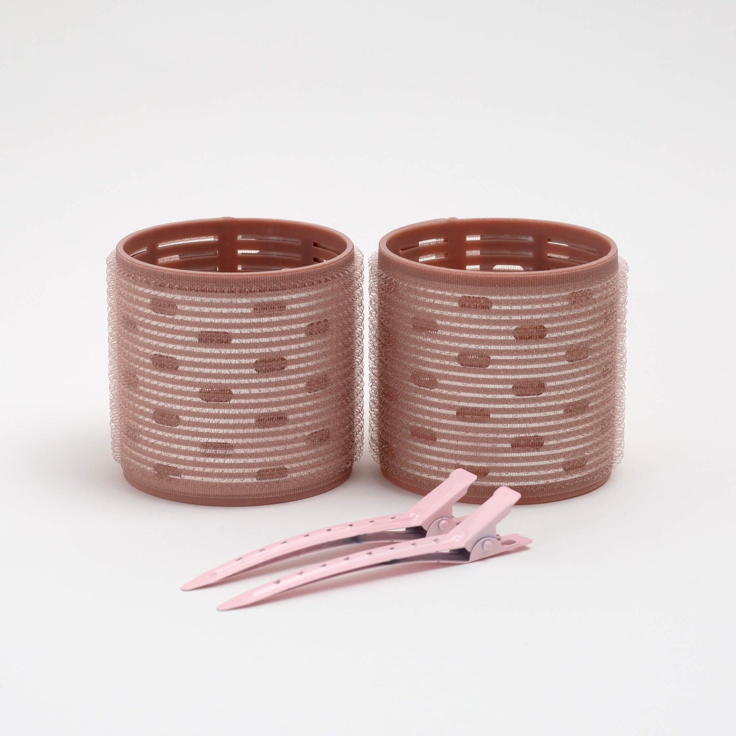 THOC  Ceramic Thermal Hair Rollers Two medium sized shown upright with hair pins lying next to