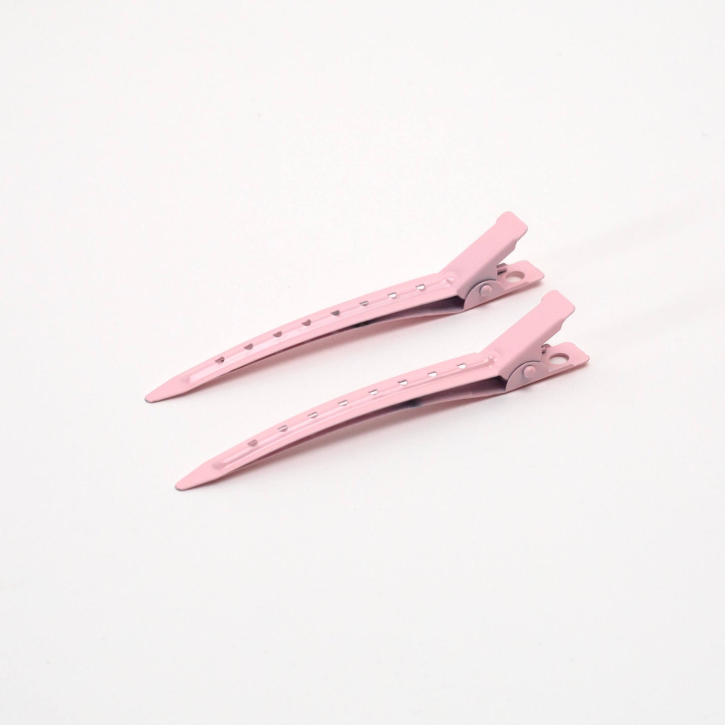 Pair of THOC roller hair pins pink on a white background