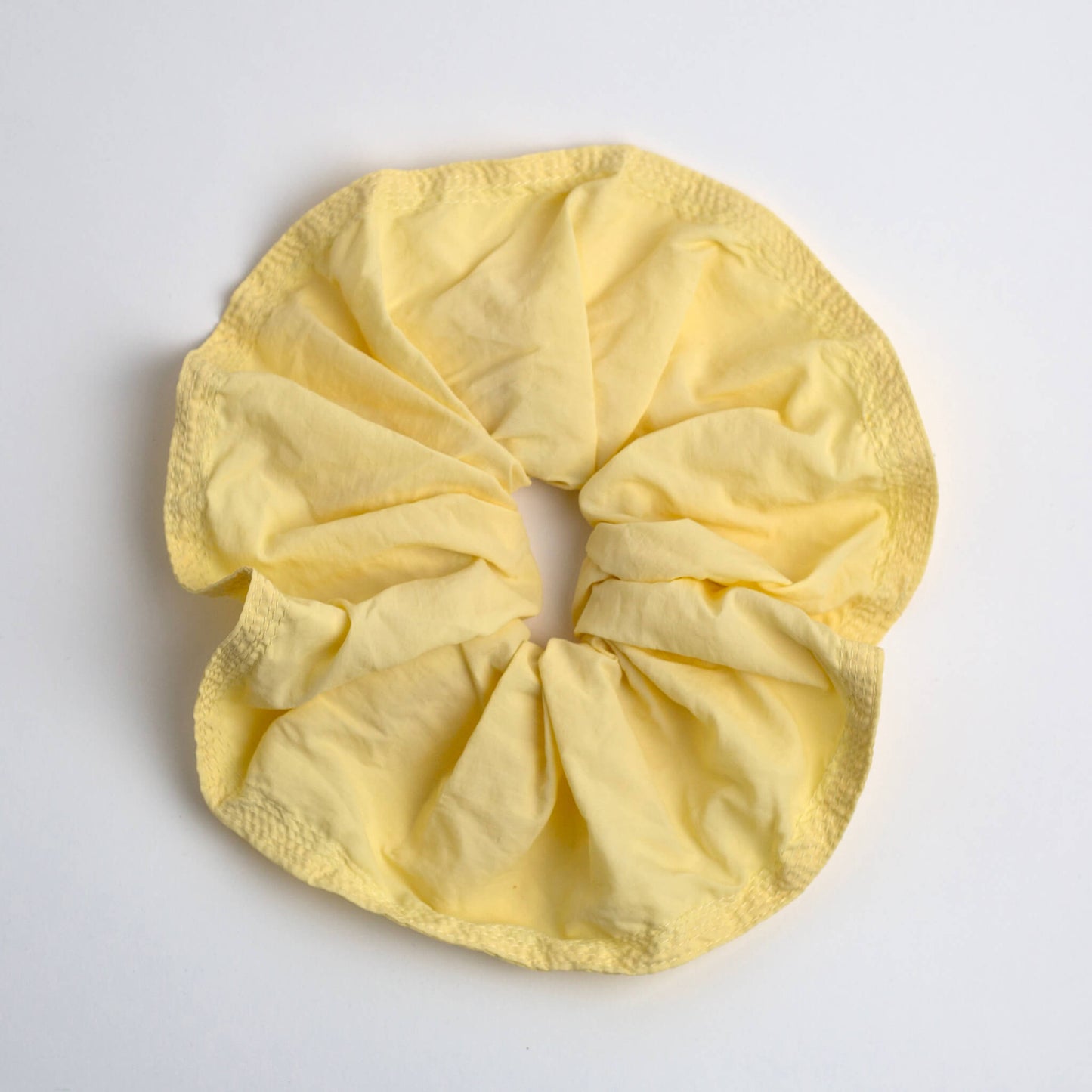THOC Blush Scrunchie in Lemon Sherbet colour shown on a white background