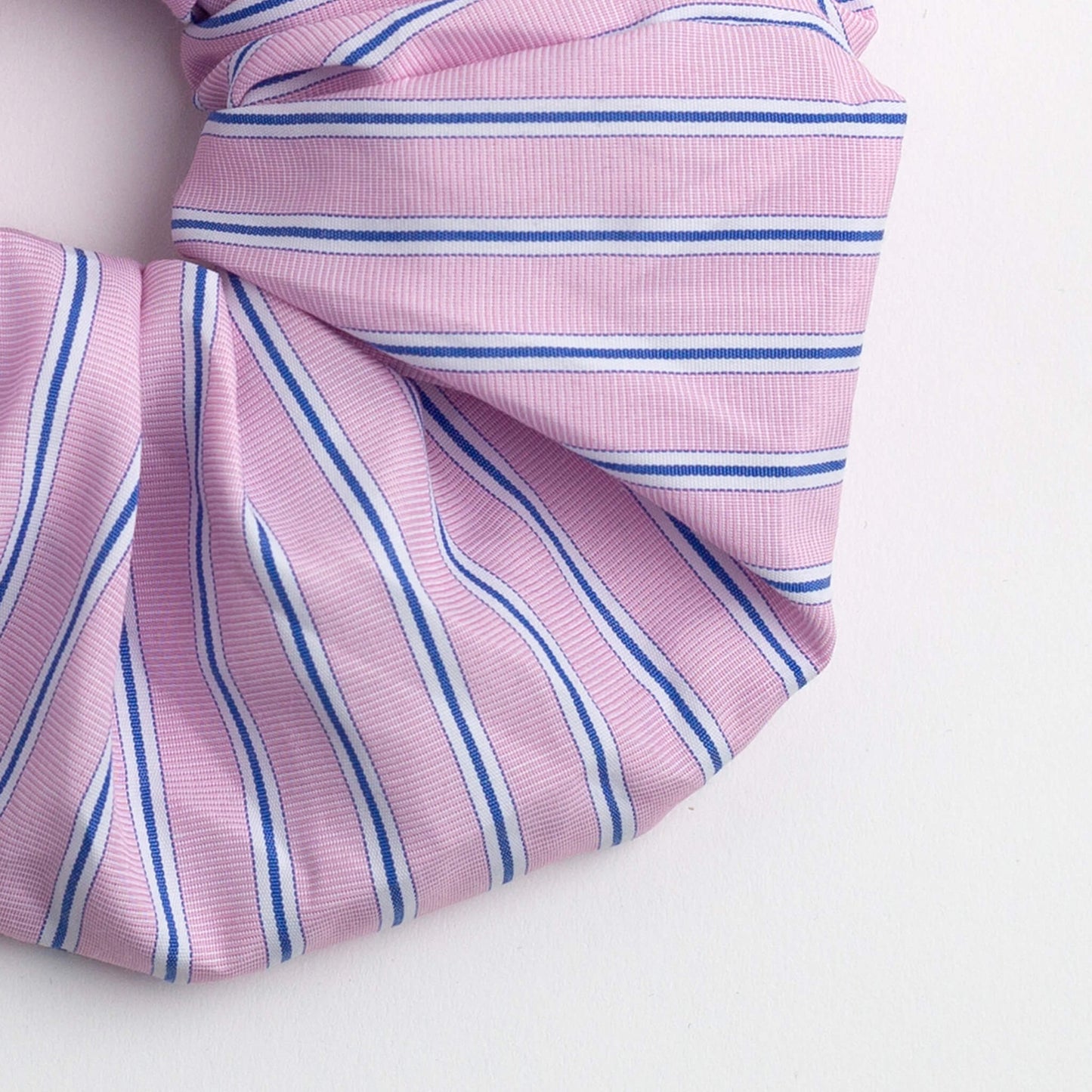 Close up of THOC Blush Stripe Scrunchie in Rose Sorbet colour shown on a white background
